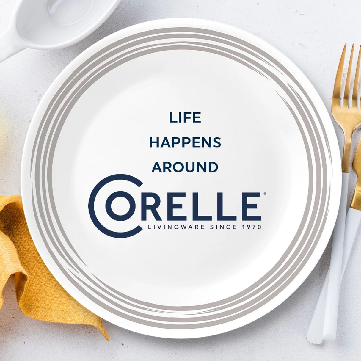 Brushed Silver dinnerplate with text life happens around Corelle