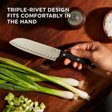 Essentials Santoku knife with text triple-rivet design fits comfortably in the hand